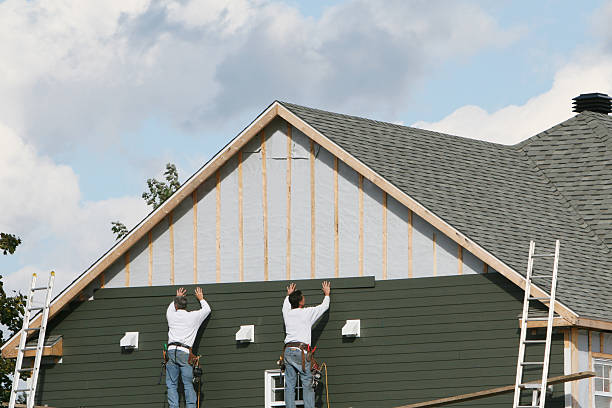 Professional Storm Damage Siding Repair technician working in Homestead, PA